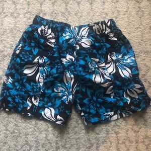 Men’s blue, navy, and white swim trunks